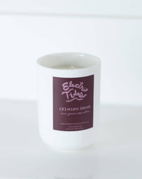 Candle with a purple label on a white background