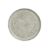 Speckled ceramic plate on a white background