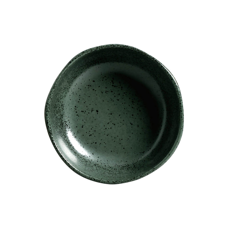 Green ceramic bowl with speckled texture on a white background