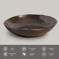 Black ceramic pasta plate on a light gray background with safety and feature icons at the bottom.