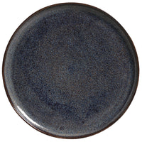 Round ceramic plate with a textured blue-gray surface on a white background