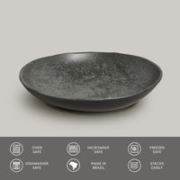 Black ceramic pasta plate on a light gray background with safety and feature icons at the bottom.