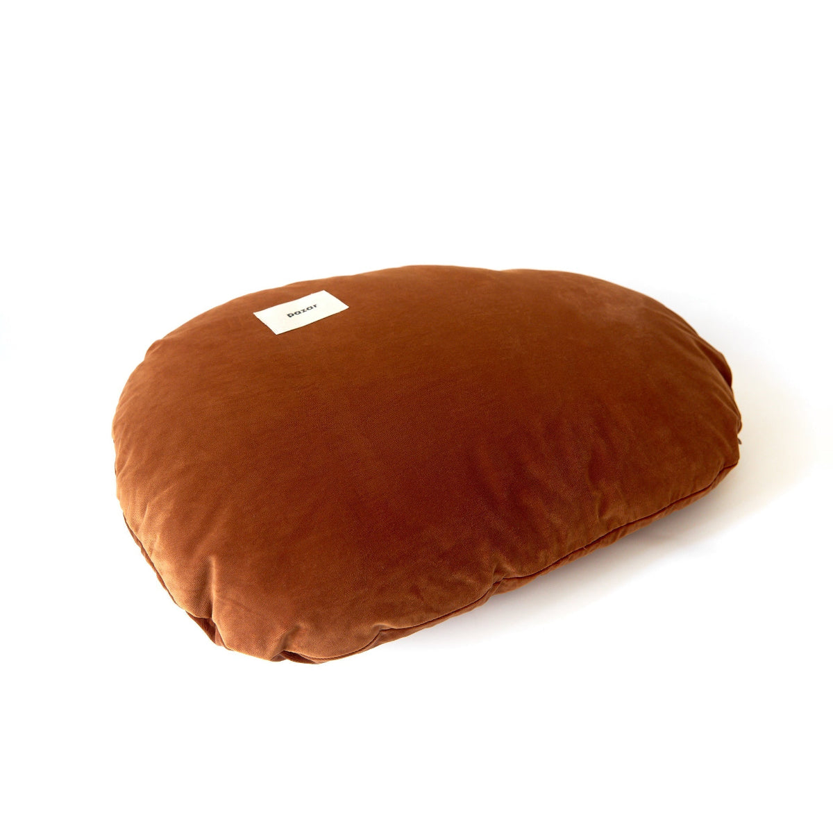 Brown pillow with a label on a white background