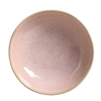 Ceramic bowl with a speckled finish on a white background