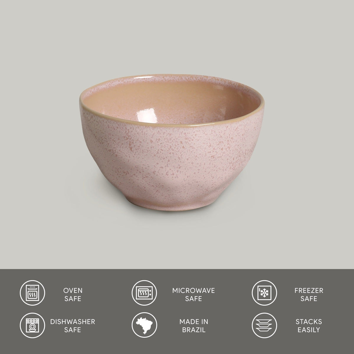 Pink ceramic bowl on a gray background with safety and feature icons at the bottom.