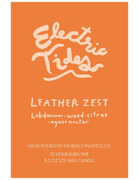 Orange candle label with 'Electric Tides' branding and product details.