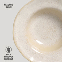 Ceramic bowl with reactive glaze on a light background