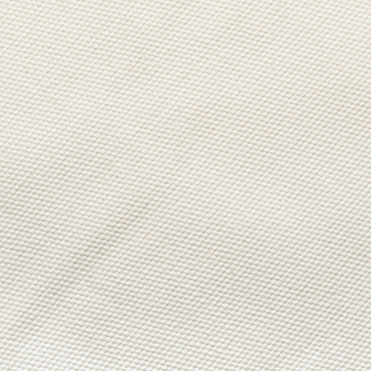 Close-up of a textured white fabric surface