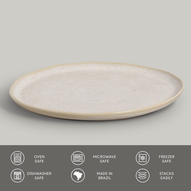 Round ceramic plate with textured surface on a gray background