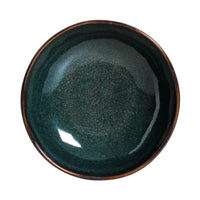 Deep teal ceramic bowl on a white background