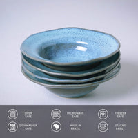 Stack of blue ceramic bowls on a light gray background with safety and origin icons at the bottom.