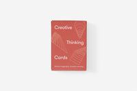 Red card deck packaging with 'Creative Thinking Cards' text on a white background