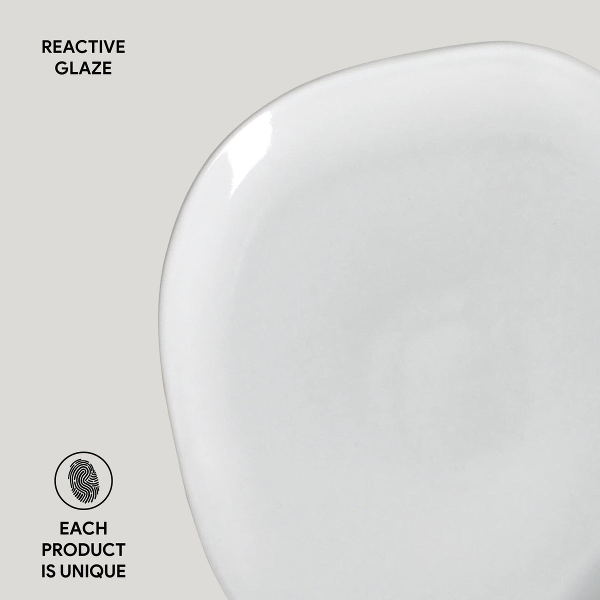 White ceramic plate with 'Reactive Glaze' text and 'Each Product is Unique' label on a light gray background