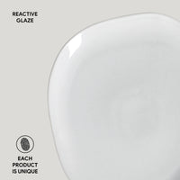 White ceramic plate with 'Reactive Glaze' text and 'Each Product is Unique' label on a light gray background