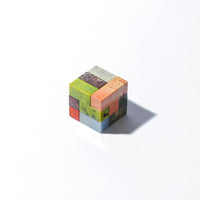Colorful cube stone puzzle on a white background