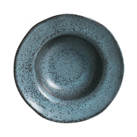 Blue ceramic bowl with speckled texture on a white background