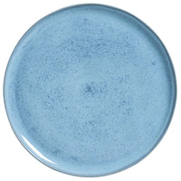 Blue ceramic plate on a white background