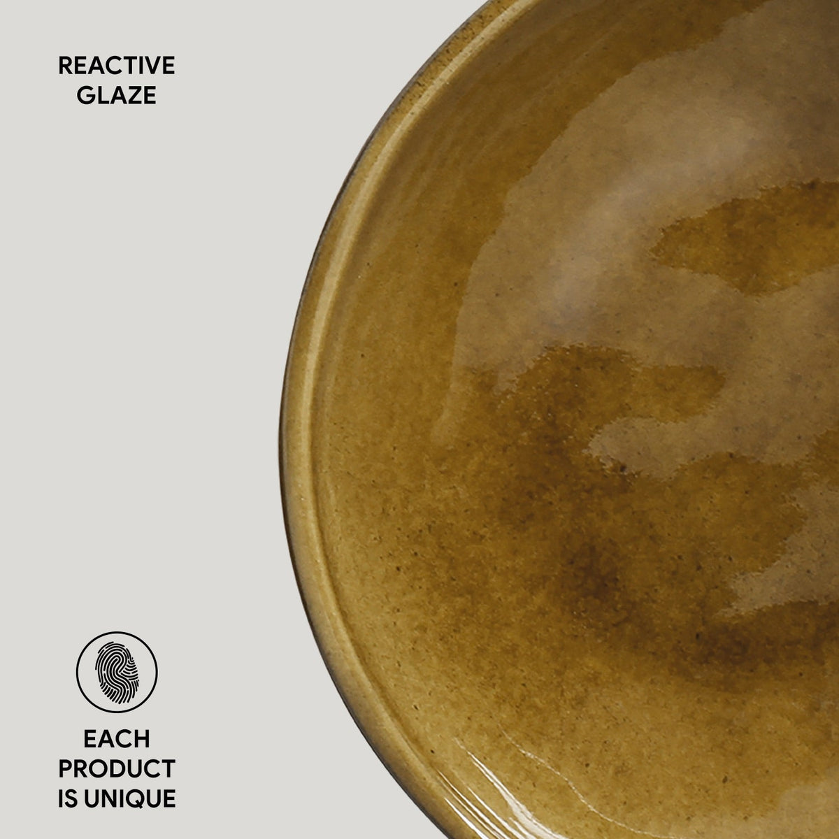 Brown ceramic bowl with reactive glaze on a light gray background