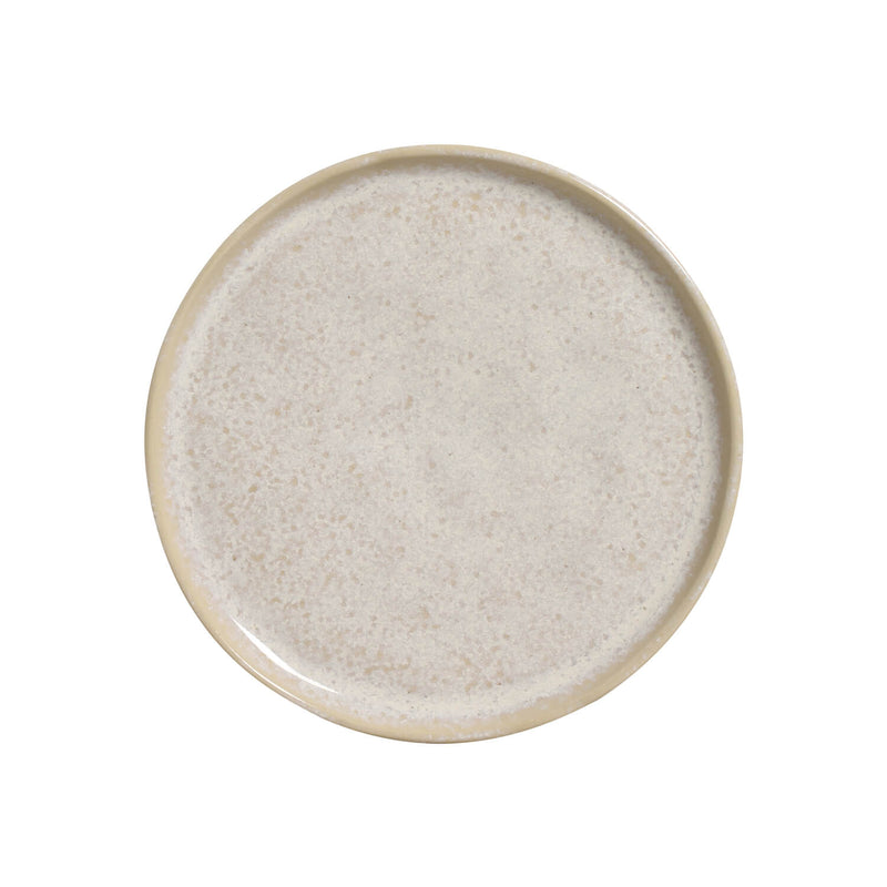 Round ceramic plate with a textured surface on a white background