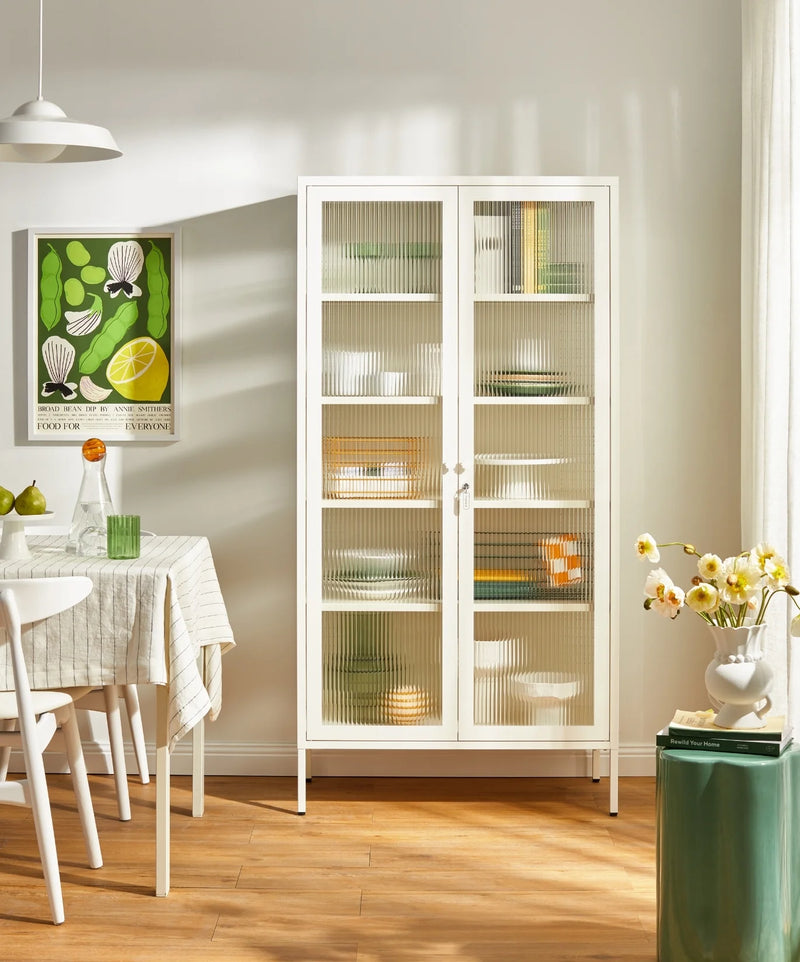 White cabinet with glass doors and decorative items in a dining room