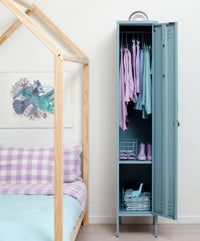 Blue locker with clothes inside next to a wooden bed with plaid bedding.