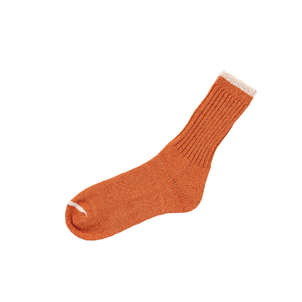 Orange crew sock with cream stripe on white background