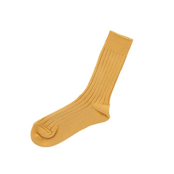Golden yellow cotton sock on white background