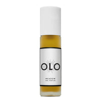 Perfume bottle labeled 'OLO' with a white cap and gold body on a white background
