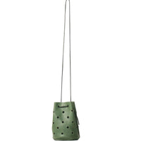 Green perforated bag with a string strap on a white background