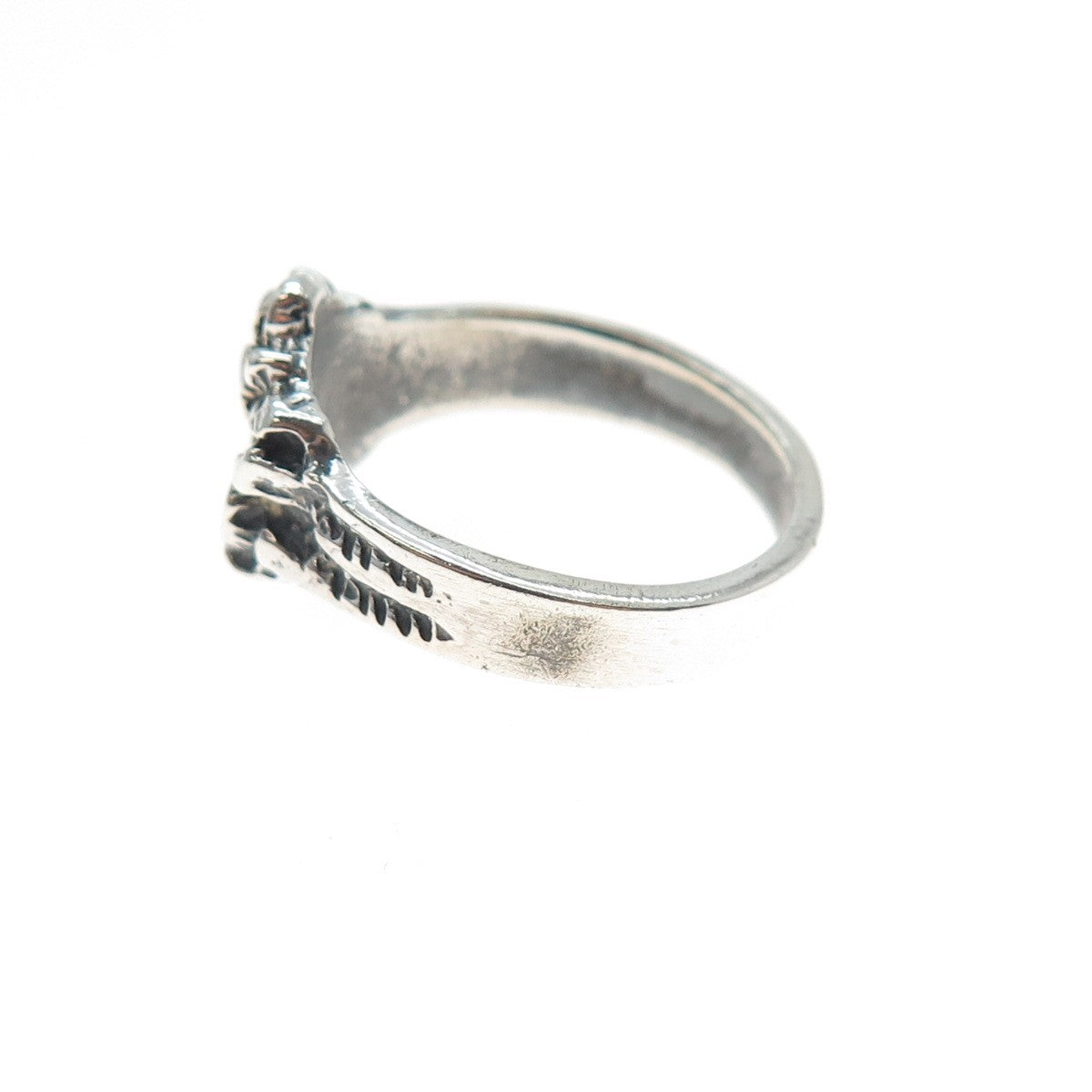 Silver ring with texture on a white background