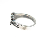 Silver ring with texture on a white background