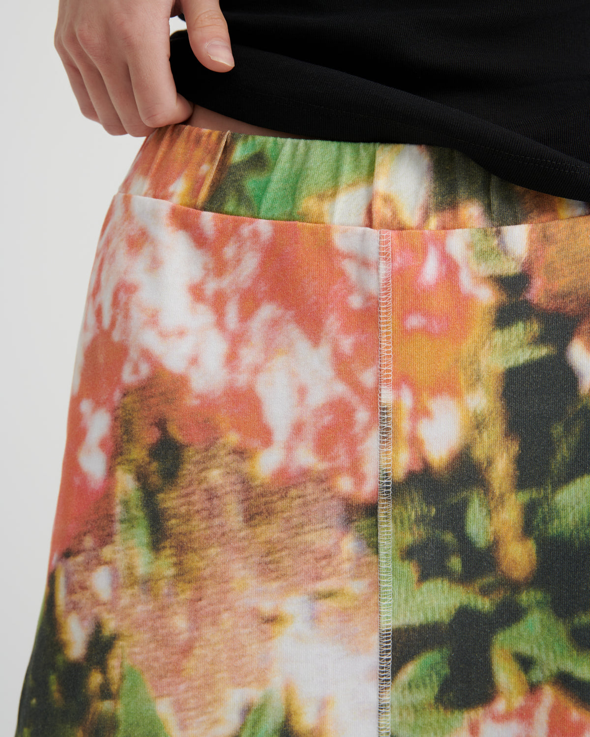 Close-up of a colorful floral-patterned fabric with a plain background